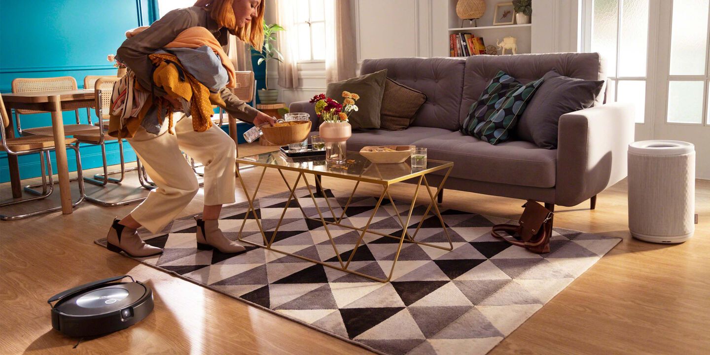 woman walking around and roomba combo 