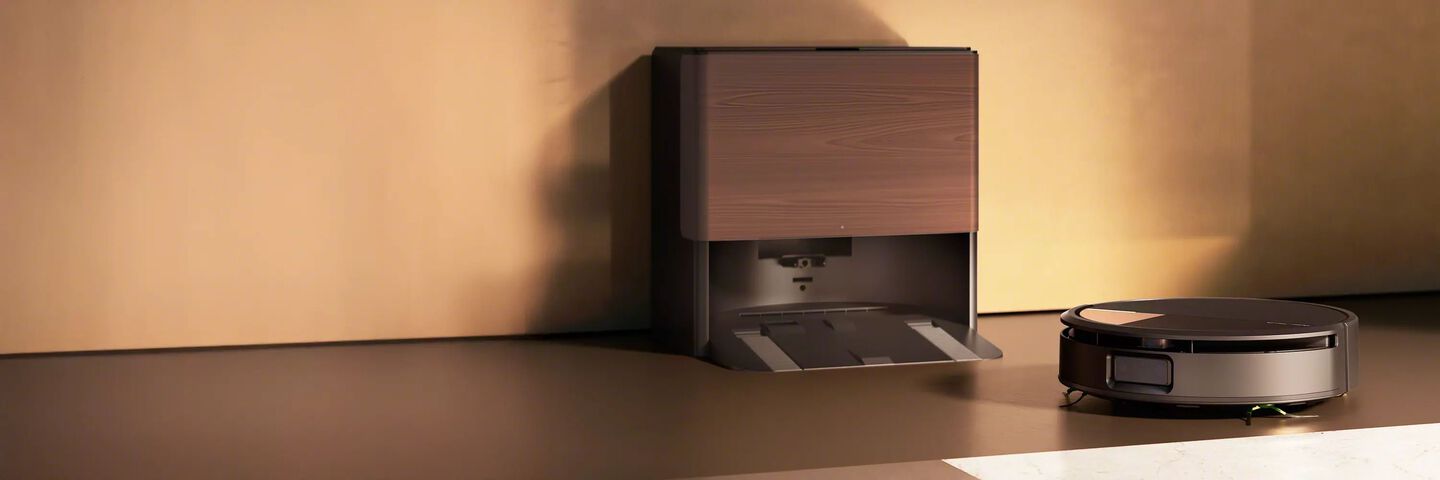 Roomba® Max 705 Combo in a room with dark lighting