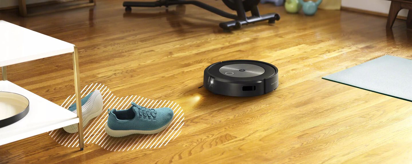 A Roomba detecting shoes on the floor