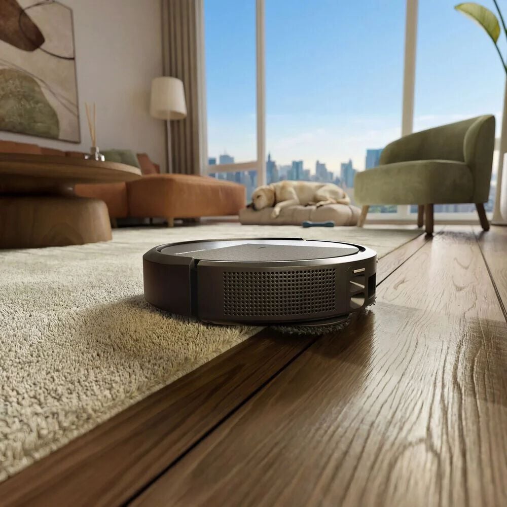 Roomba&reg; Plus 515 Combo Robot auto emptying debris while heat-washing then heat-drying mop pads.